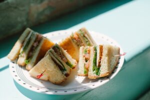 Vegan Club Sandwich with marinated tofu, bacun bits, tomato, and lettuce. Located at Spiral Diner in Fort Worth
