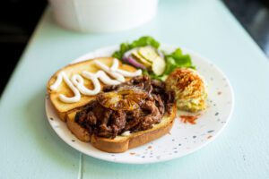 Vegan Jamaican Jerk sandwich with pickles and caramelized pineapple from Spiral Diner
