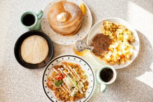 Vegan weekend brunch at Spiral Diner — cinnamon roll pancakes, French toast plates, breakfast melts, and cozy diner classics.